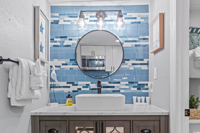 2001 S Ocean Blvd Unit 1408, Myrtle Beach, SC 29577 - bathroom featuring vanity and tasteful backsplash