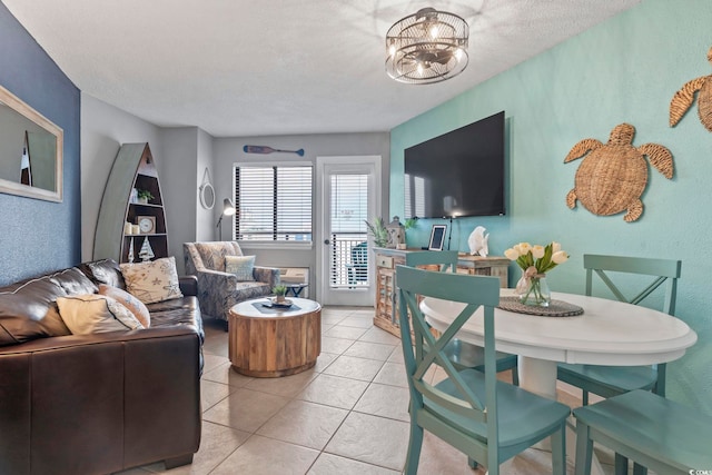2001 S Ocean Blvd Unit 1408, Myrtle Beach, SC 29577 - living room featuring light tile patterned floors, a chandelier, and a textured ceiling