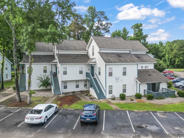 4344 Spa Dr Unit 605, Little River, SC 29566 - view of property featuring stairs and uncovered parking
