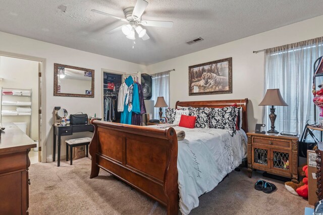 4344 Spa Dr Unit 605, Little River, SC 29566 - carpeted bedroom with a textured ceiling, a spacious closet, a closet, and a ceiling fan