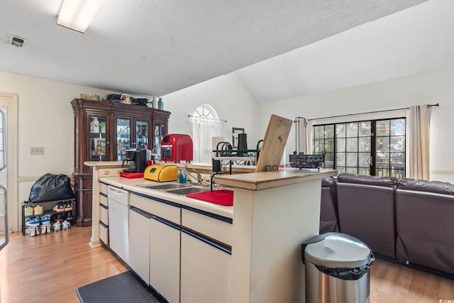 4344 Spa Dr Unit 605, Little River, SC 29566 - kitchen with open floor plan, light wood-style flooring, white cabinetry, a kitchen island with sink, and plenty of natural light