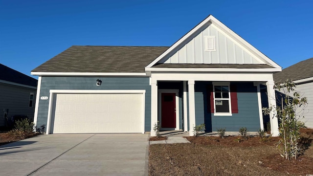173 Dagger Ct, Myrtle Beach, SC 29588 - view of front of property with board and batten siding, an attached garage, driveway, and covered porch