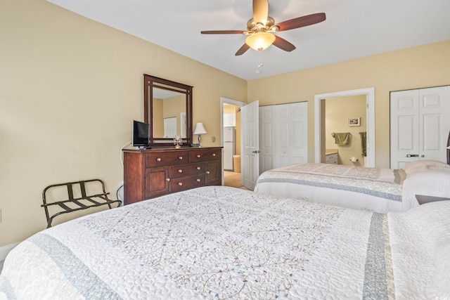 1009 World Tour Blvd Unit 105, Myrtle Beach, SC 29579 - bedroom with multiple closets, connected bathroom, and ceiling fan