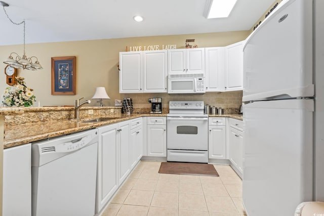 1009 World Tour Blvd Unit 105, Myrtle Beach, SC 29579 - kitchen featuring white appliances, decorative backsplash, light tile patterned floors, white cabinets, and recessed lighting