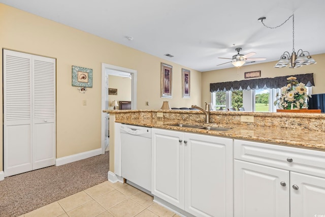 1009 World Tour Blvd Unit 105, Myrtle Beach, SC 29579 - kitchen with dishwasher, light colored carpet, a ceiling fan, and white cabinets