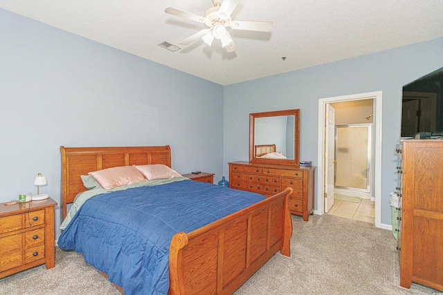 2060 Cross Gate Blvd Unit 102, Surfside Beach, SC 29575 - bedroom featuring light carpet, a ceiling fan, and connected bathroom