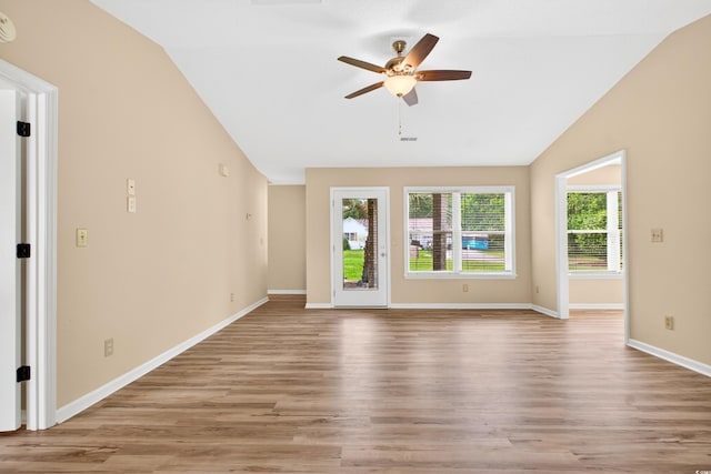 131 Pine Lake Cir, Ocean Isle Beach, NC 28469 - unfurnished living room featuring vaulted ceiling, ceiling fan, and light wood-style floors