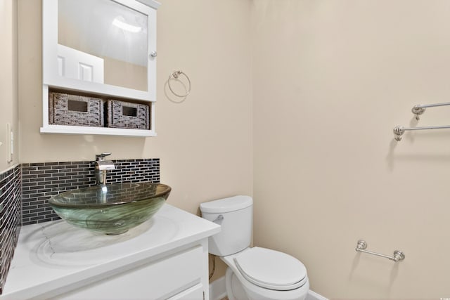 131 Pine Lake Cir, Ocean Isle Beach, NC 28469 - bathroom featuring vanity and decorative backsplash