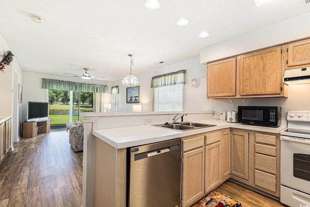 537 White River Dr Unit 17C, Myrtle Beach, SC 29579 - kitchen with stainless steel dishwasher, white range with electric stovetop, black microwave, a peninsula, and wood finished floors