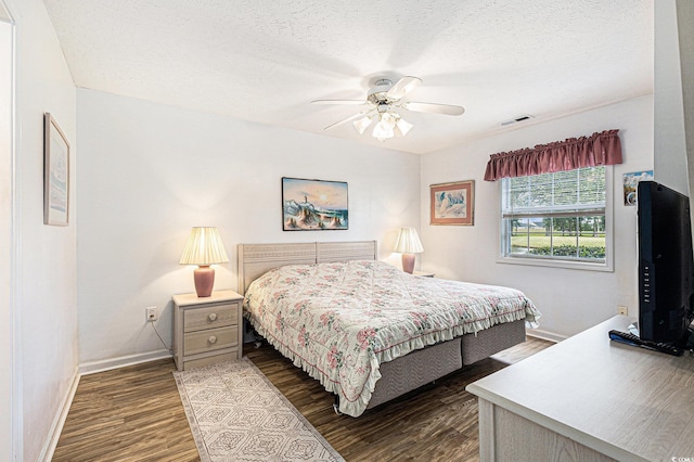 537 White River Dr Unit 17C, Myrtle Beach, SC 29579 - bedroom featuring dark wood-style floors, ceiling fan, and a textured ceiling