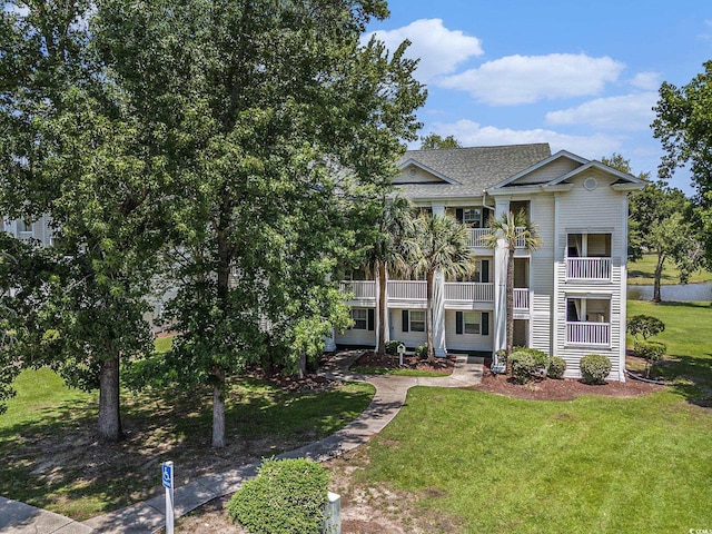 537 White River Dr Unit 17C, Myrtle Beach, SC 29579 - view of front of property with a front lawn and roof with shingles
