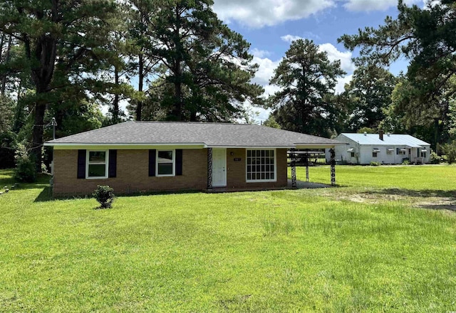109 S Maple Ave, Andrews, SC 29510 - single story home featuring a carport, a front lawn, and brick siding