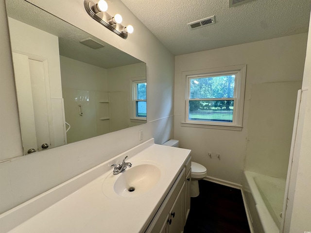 109 S Maple Ave, Andrews, SC 29510 - bathroom featuring vanity, a tub, a textured ceiling, a shower, and wood finished floors