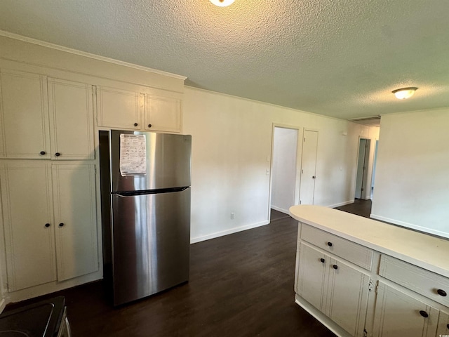 109 S Maple Ave, Andrews, SC 29510 - kitchen featuring freestanding refrigerator, a textured ceiling, dark wood-style floors, and light countertops