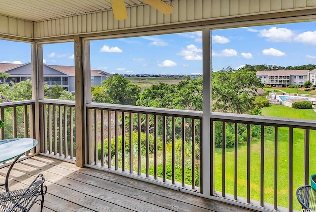 140 S Cove Pl Unit 6C, Pawleys Island, SC 29585 - deck featuring a ceiling fan, a lawn, and a residential view