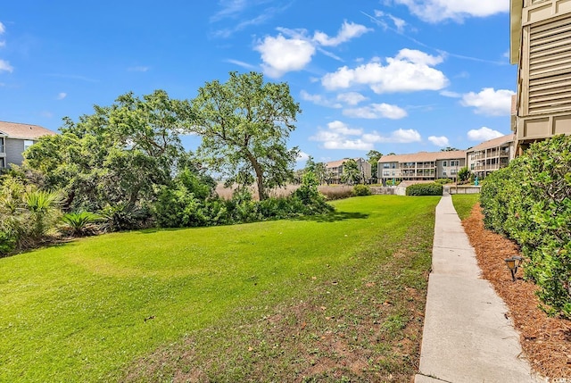 140 S Cove Pl Unit 6C, Pawleys Island, SC 29585 - view of green lawn with a residential view