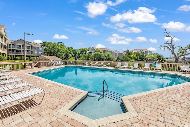 140 S Cove Pl Unit 6C, Pawleys Island, SC 29585 - community pool with a patio and a residential view