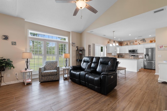 503 20th Ave N Unit 29-C, North Myrtle Beach, SC 29582 - living room with a ceiling fan, wood finished floors, a chandelier, high vaulted ceiling, and recessed lighting