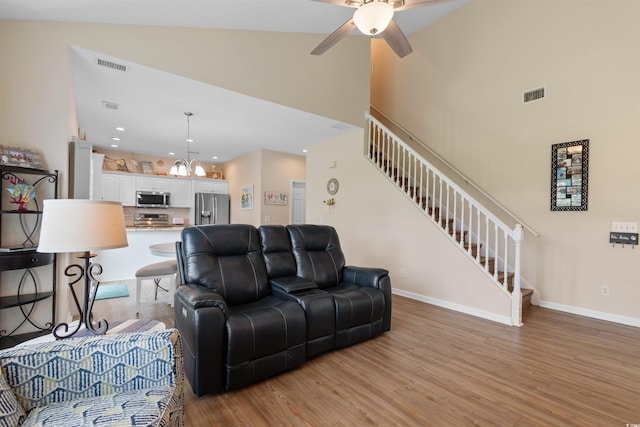 503 20th Ave N Unit 29-C, North Myrtle Beach, SC 29582 - living area with stairs, light wood-type flooring, a ceiling fan, high vaulted ceiling, and recessed lighting