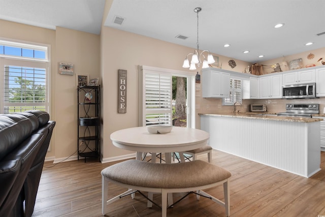 503 20th Ave N Unit 29-C, North Myrtle Beach, SC 29582 - dining room featuring a chandelier, light wood finished floors, and recessed lighting