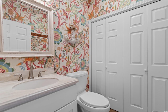 503 20th Ave N Unit 29-C, North Myrtle Beach, SC 29582 - half bath with wallpapered walls, a closet, and vanity