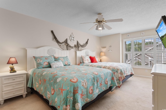 503 20th Ave N Unit 29-C, North Myrtle Beach, SC 29582 - bedroom featuring light colored carpet, a ceiling fan, and a textured ceiling