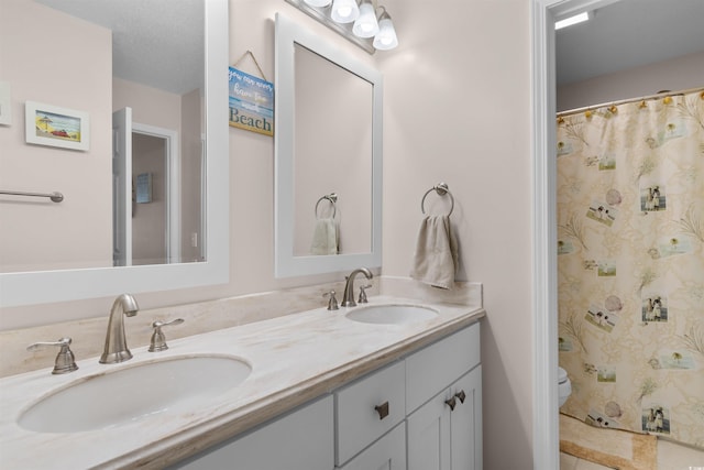 503 20th Ave N Unit 29-C, North Myrtle Beach, SC 29582 - bathroom with double vanity and curtained shower