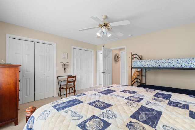 503 20th Ave N Unit 29-C, North Myrtle Beach, SC 29582 - carpeted bedroom featuring two closets and ceiling fan