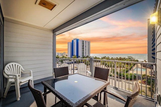 2000 S Ocean Blvd Unit V405, Myrtle Beach, SC 29577 - balcony featuring a water view and outdoor dining space