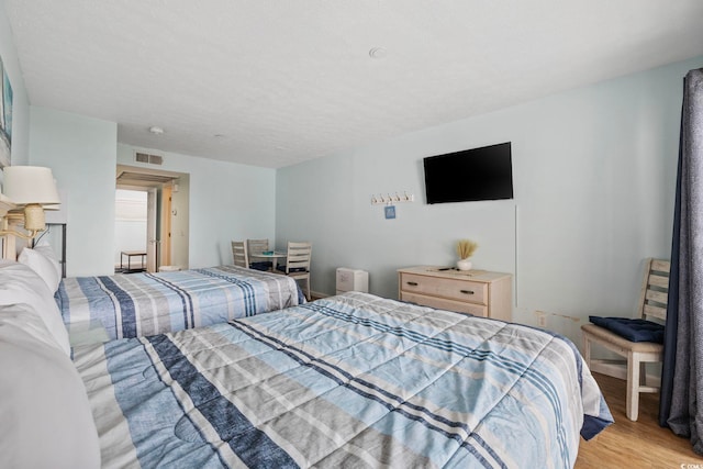 2000 S Ocean Blvd Unit V405, Myrtle Beach, SC 29577 - bedroom featuring light wood-style flooring