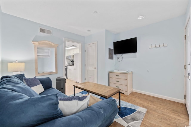 2000 S Ocean Blvd Unit V405, Myrtle Beach, SC 29577 - living room featuring light wood finished floors and baseboards