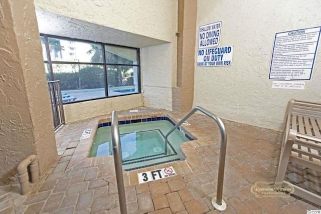 2000 S Ocean Blvd Unit V405, Myrtle Beach, SC 29577 - view of swimming pool featuring a hot tub