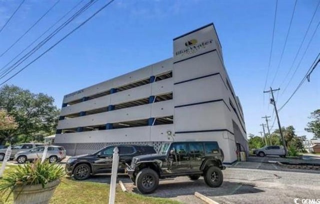 2000 S Ocean Blvd Unit V405, Myrtle Beach, SC 29577 - view of building exterior with uncovered parking
