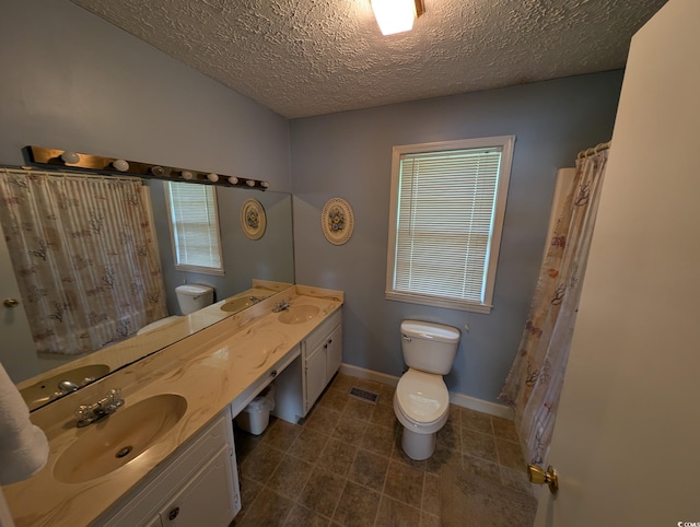 5370 Miracle Ln, Conway, SC 29526 - full bath with double vanity, a textured ceiling, and tile patterned floors