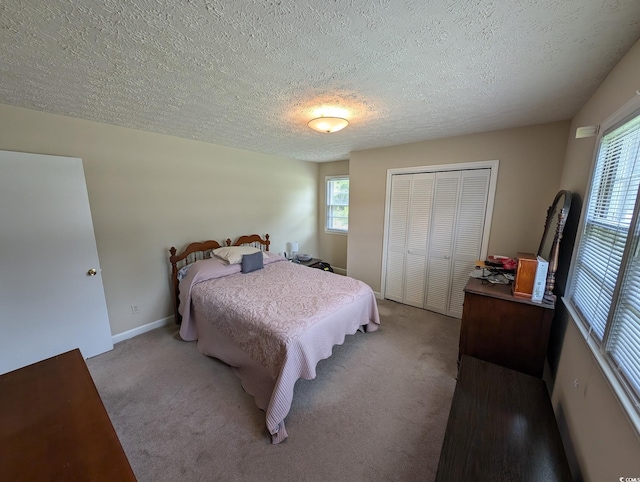 5370 Miracle Ln, Conway, SC 29526 - bedroom with carpet floors, a closet, multiple windows, and a textured ceiling