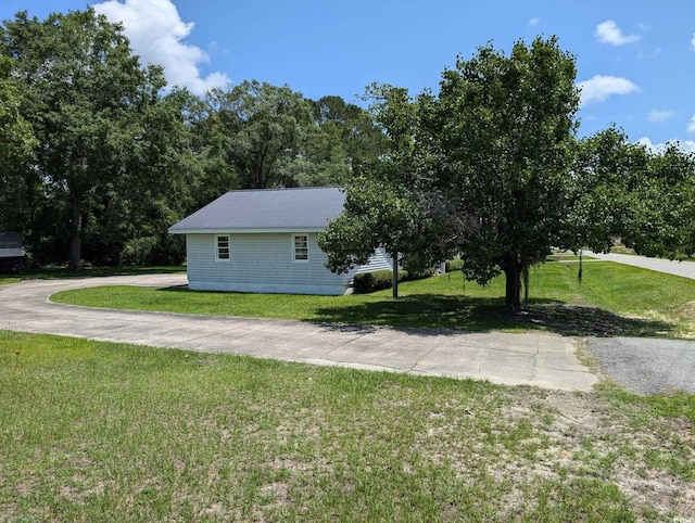 5370 Miracle Ln, Conway, SC 29526 - view of side of home with a yard and a metal roof