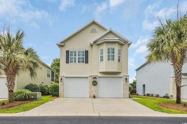 1413 Cottage Cove Cir N, Myrtle Beach, SC 29582 - view of front facade featuring concrete driveway, an attached garage, and brick siding