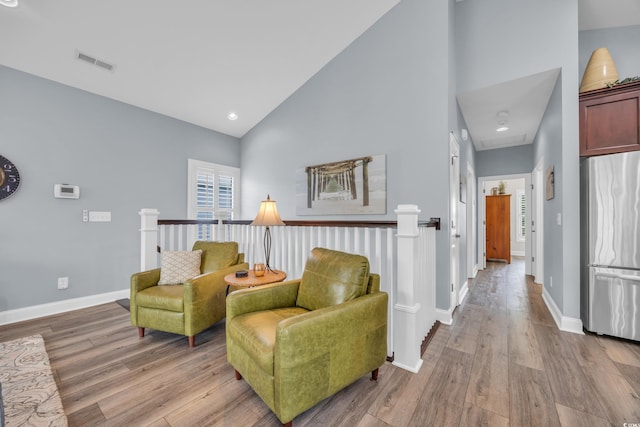 1413 Cottage Cove Cir N, Myrtle Beach, SC 29582 - living area featuring light wood-style flooring and high vaulted ceiling