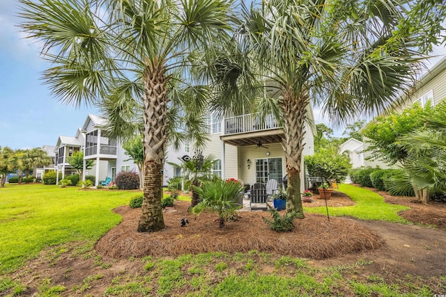 1413 Cottage Cove Cir N, Myrtle Beach, SC 29582 - rear view of property featuring a balcony, a lawn, and a ceiling fan