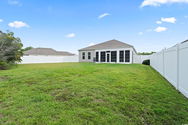 308 Firenze Loop, Myrtle Beach, SC 29579 - back of property featuring a fenced backyard and a sunroom