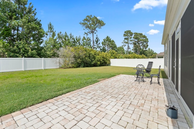 308 Firenze Loop, Myrtle Beach, SC 29579 - fenced backyard with a patio area