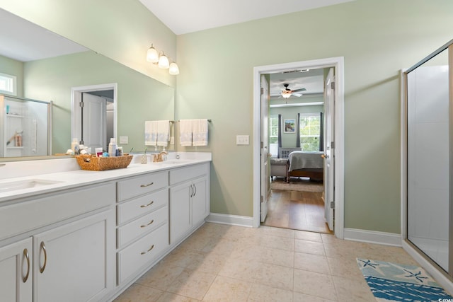 308 Firenze Loop, Myrtle Beach, SC 29579 - ensuite bathroom featuring double vanity, a shower stall, a ceiling fan, and tile patterned floors