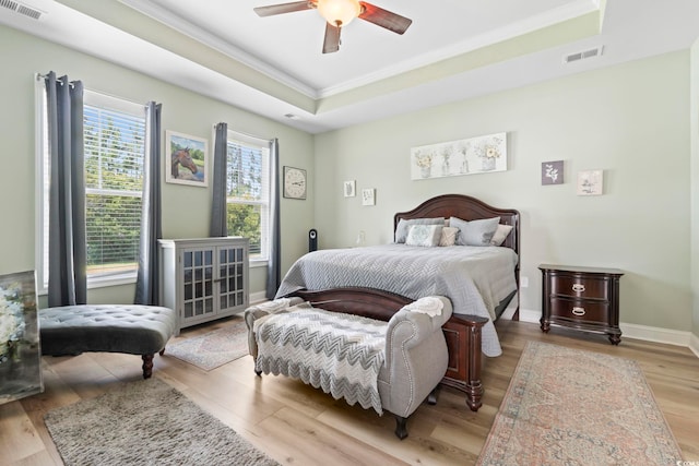 308 Firenze Loop, Myrtle Beach, SC 29579 - bedroom featuring a tray ceiling, crown molding, wood finished floors, and a ceiling fan
