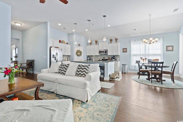 308 Firenze Loop, Myrtle Beach, SC 29579 - living room featuring wood finished floors, a chandelier, a ceiling fan, recessed lighting, and lofted ceiling
