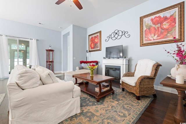 308 Firenze Loop, Myrtle Beach, SC 29579 - living area featuring a ceiling fan, wood finished floors, a glass covered fireplace, and french doors