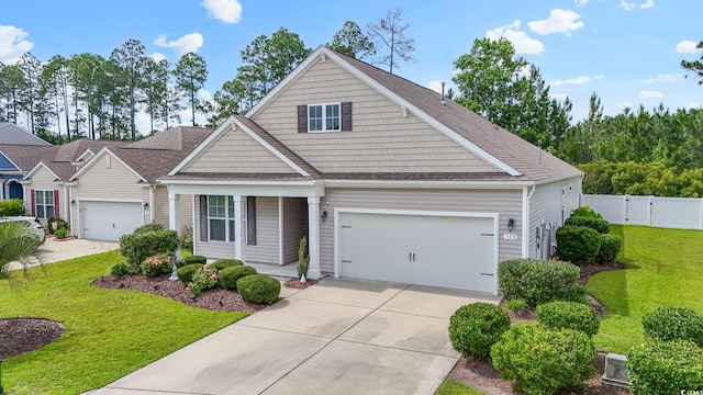 308 Firenze Loop, Myrtle Beach, SC 29579 - traditional home with concrete driveway, an attached garage, and a shingled roof
