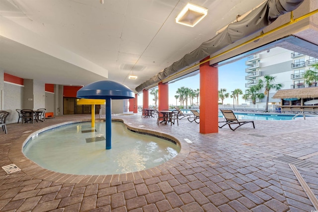 7200 N Ocean Blvd Unit 257, Myrtle Beach, SC 29572 - community pool with a patio area and outdoor dining space