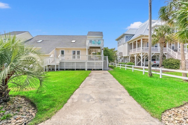 4806 S Ocean Blvd, Surfside Beach, SC 29575 - view of building exterior featuring concrete driveway and stairs