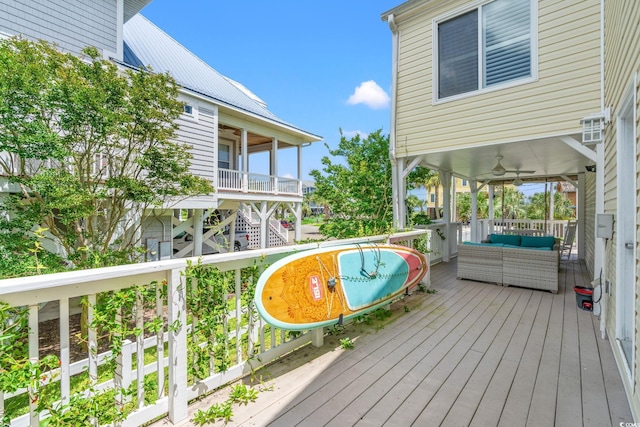 4806 S Ocean Blvd, Surfside Beach, SC 29575 - wooden deck with a ceiling fan and an outdoor hangout area