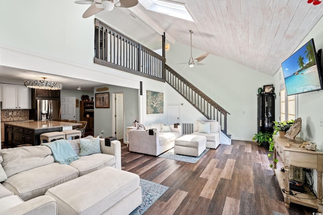 4806 S Ocean Blvd, Surfside Beach, SC 29575 - living area featuring ceiling fan, stairs, high vaulted ceiling, a skylight, and dark wood-type flooring
